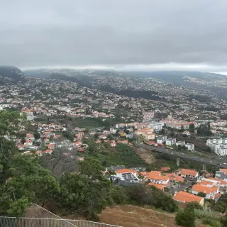 View from Pico dos Barcelos over the Funchal suburbs and the motorway viaduct on a cloudy day